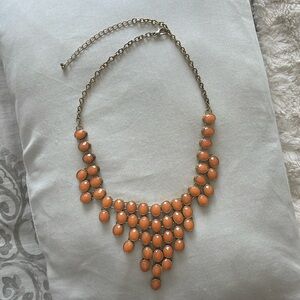 Coral colored necklace with lobster clamp for adjustable size